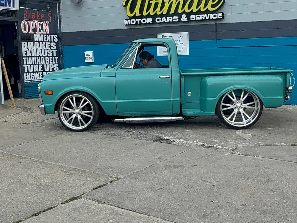 Restored classic Chevrolet pickup parked outside our auto repair shop