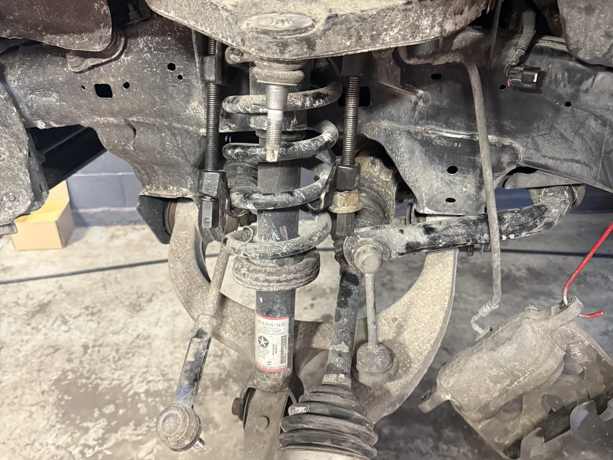 Front suspension components on a vehicle before repair