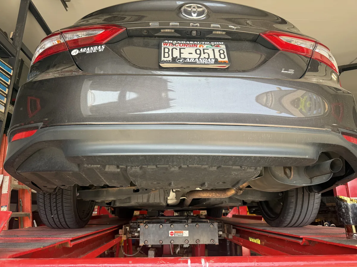 New rear muffler and polished tailpipe after replacement