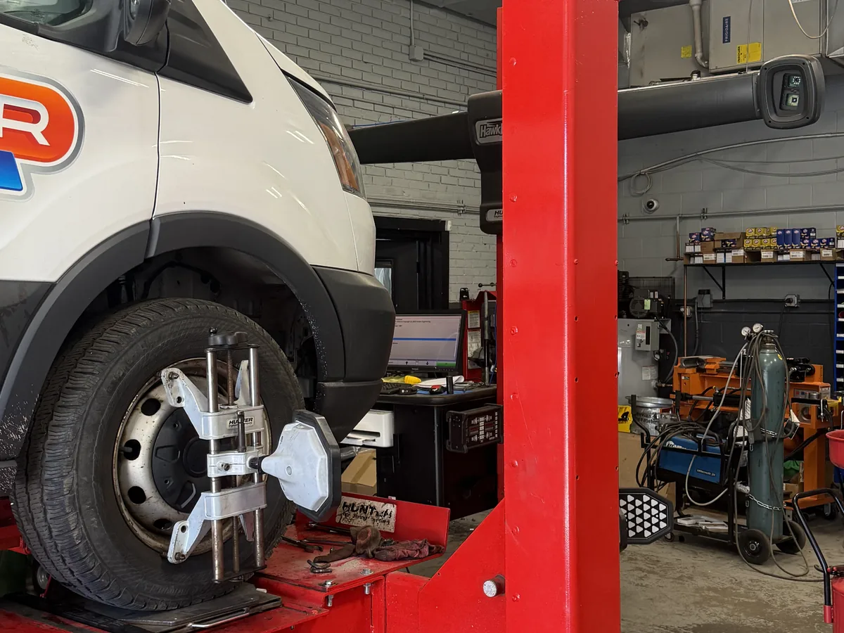 Alignment target mounted to a van wheel on the alignment rack